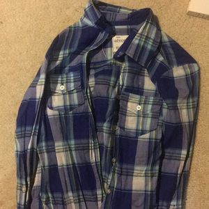 Plaid long sleeve button down shirt.